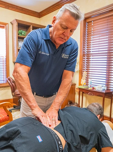 Chiropractor The Villages FL R. Kim Etheredge Adjusting Patient Thank You Chiropractor The Villages FL R. Kim Etheredge Adjusting Patient Thank You